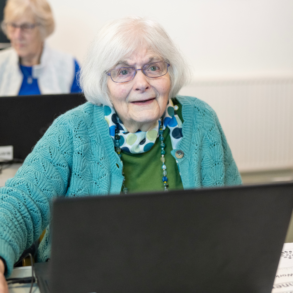 man sat in front of a computer