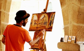 A painting of a man painting at an easel of a historical street
