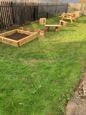 green space with wood boxed garden planters