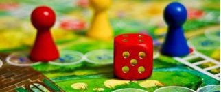 snakes and ladders game board with dice and counter pieces