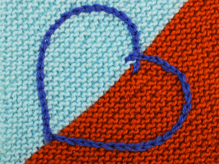 Knitted Care Square with an embroidered heart