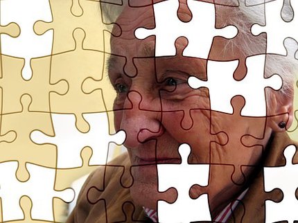 jigsaw with missing pieces of older lady