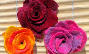 Three coloured roses made  out of felt