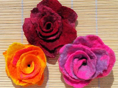 Three coloured roses made  out of felt