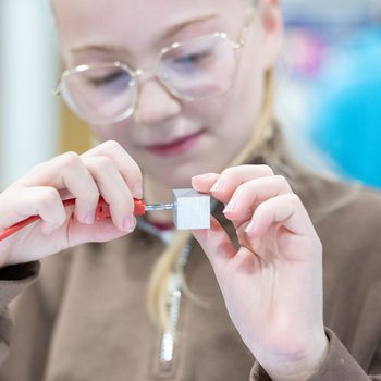 girl doing science activity