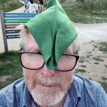 Alistair Morrison wearing a green felt Robin Hood hat