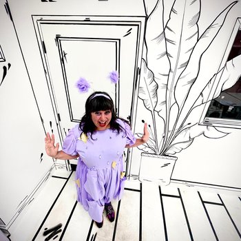 Brigitte Aphoride wearing a lilac alien outfit