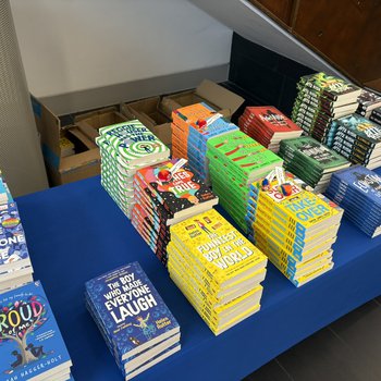 A table with piles of books