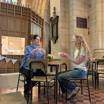 2 women having a cup of tea in the cafe at St Mary Magdelene Church, Newark.