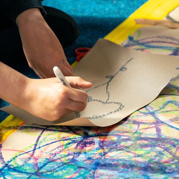 A close up of a child's hand drawing