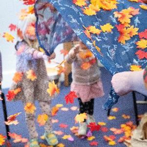 Children playing in coloured leaves
