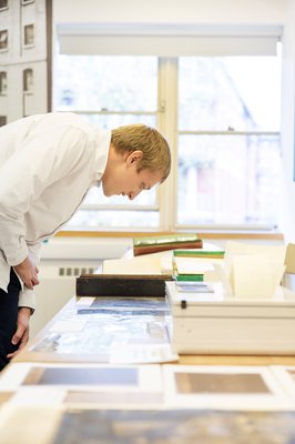 Man looking at old documents