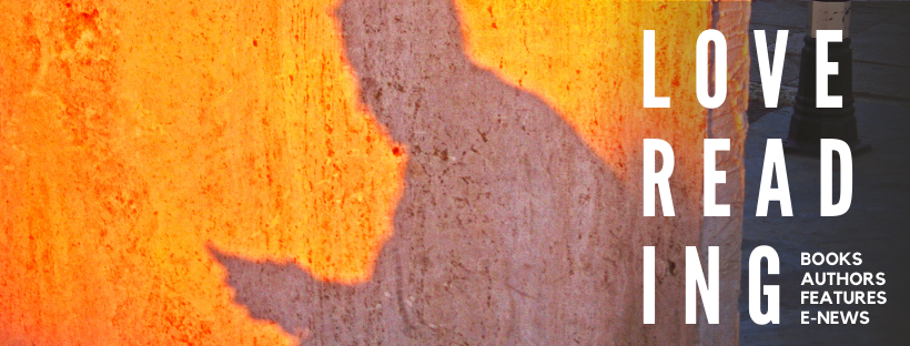 an image showing golden sunlight casting a shadow against a wall of a person reading a book. The image contains the text "Love reading"