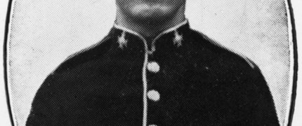an old black and white photo of a young man in military uniform