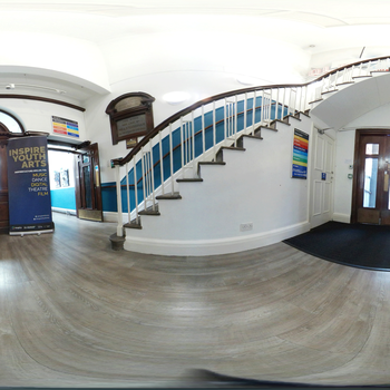 Artistic image of a foyer with staircase