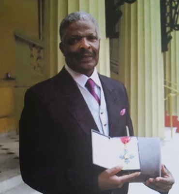 Pastor Weaver showing his medal
