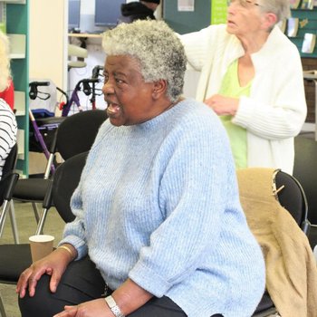 Women singing at Sing with friends session.