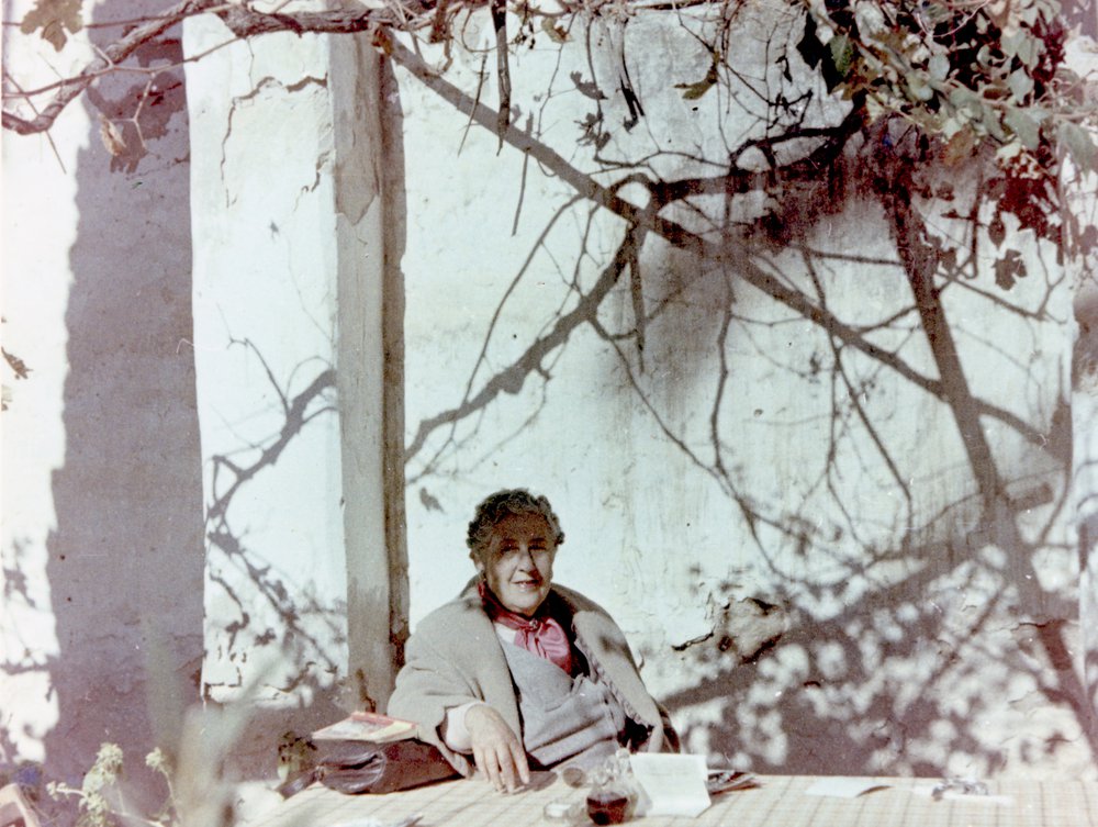 Agatha Christie relaxing during a sightseeing tour, Tajoura, Libya, 1955. © The Christie Archive Trust
