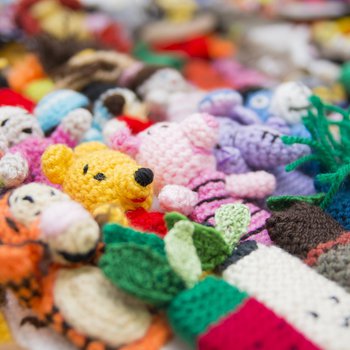 Rows of knitted finger puppets