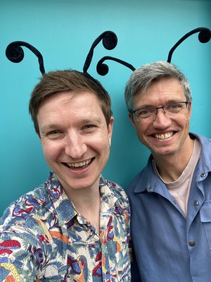 Photo of poet Simon Mole and musician Gecko on a blue background.
