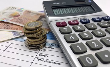 Notes and coins with a calculator