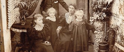 black and white photo of a victorian family a mum dad and three daughters