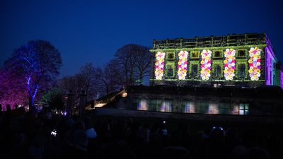 Colourful flowers projected on to Nottingham Castle