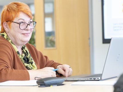 smiling adult learner computer Kirkby learning centre (1).jpg
