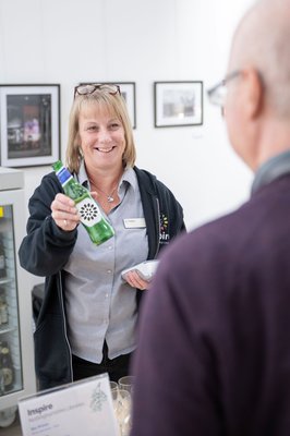 staff serving drinks smiling at jazz event at Beeston library