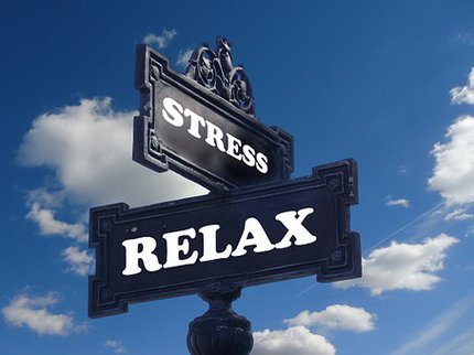 Post with direction signs saying stress and relax