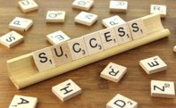 Letter tiles spelling the word success